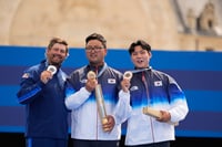 | Photo: AP/Brynn Anderson : Archery men's individual medal ceremony: Gold medalist, South Korea's Kim Woo-jin, center with Brady Ellison and Lee Woo-seok